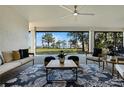 Elegant covered patio featuring stylish furniture and scenic lake views at 1475 Warrior Trl, Enterprise, FL 32725