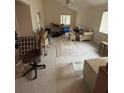View of the spacious living room featuring a tiled floor and natural light from the windows at 250 Raintree Dr, Casselberry, FL 32707