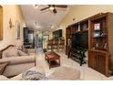 Open-concept living area with high ceilings, ceiling fan, and seamless kitchen access at 358 Douglas Way # 78, Winter Garden, FL 34787