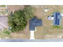 Bird's eye view of a single-Gathering home showcasing its roof and surrounding landscape at 4914 Sw 147Th Loop, Ocala, FL 34473