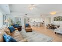 Inviting living room featuring tile floors, comfortable seating, and easy access to the kitchen at 5300 S Atlantic Ave # 7-301, New Smyrna Beach, FL 32169