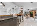 Modern kitchen featuring granite countertops, stainless steel wine cooler, and open floor plan at 6339 Coopers Green Ct, Orlando, FL 32819