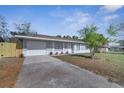 Charming single-story home featuring a well-maintained lawn and a welcoming front entrance at 8960 Se 88Th Pl, Ocala, FL 34472