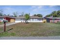 Charming single-story home featuring a well-maintained lawn and a welcoming front entrance at 8960 Se 88Th Pl, Ocala, FL 34472