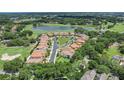 Stunning aerial view of the community with lake and golf course views from numerous homes at 1377 Tappie Toorie Cir, Lake Mary, FL 32746