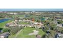 Beautiful aerial view of homes nestled on a golf course with lake views in the distance at 1377 Tappie Toorie Cir, Lake Mary, FL 32746