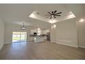 Open-concept living room showcasing recessed lighting and a kitchen in the background at 216 Homewood Dr, Sanford, FL 32773