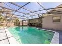 A beautiful screened-in pool surrounded by a well-maintained patio area at 3708 Pipes O The Glen Way, Orlando, FL 32808