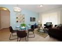 Modern living room and dining area with sleek furniture, contemporary decor, and ample natural light at 4814 Cayview Ave # 407, Orlando, FL 32819