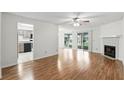 Inviting living room with a ceiling fan, fireplace, and sliding glass door to patio at 5336 White Cliff Ln # 6, Orlando, FL 32812