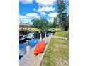 Backyard waterfront with private boat dock, kayak, and canal views at 5374 Crooked Oak Cir, St Cloud, FL 34771