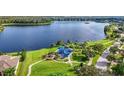 Community park with playground and walking path alongside a lake in a residential area at 6854 Remington View Ct, Orlando, FL 32829