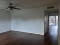 Spacious living room featuring updated flooring and a neutral color palette at 824 Town Cir # 101, Maitland, FL 32751