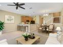 Inviting living area featuring an eat-in kitchen, dining table, and comfortable seating at 9236 Sweet Maple Ave, Orlando, FL 32832