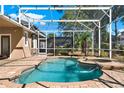 Relaxing screened-in pool and spa surrounded by brick pavers and lush greenery, offering a private retreat at 929 Arbormoor Pl, Lake Mary, FL 32746