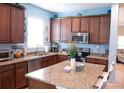 Spacious kitchen with granite countertops, stainless steel appliances, and ample cabinet space at 10942 High Bush Ct, Orlando, FL 32825