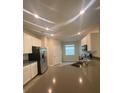 Modern kitchen featuring stainless steel appliances, white cabinets, and an open concept design at 1418 Lassen St, Haines City, FL 33844