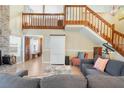 Open living room with wood floors and staircase at 1751 Meadowgold Ln, Winter Park, FL 32792