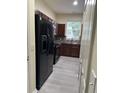 Well-designed kitchen offering ample counter space, dark cabinets, and modern appliances at 178 Chippendale Ter, Oviedo, FL 32765