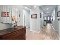 Inviting entryway with tiled floors and decorative mirror and table at 1822 Castleton Dr, St Cloud, FL 34771