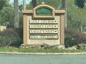 Osprey Cove community sign showcasing the community's golf course and neighborhood names at 1923 Willow Wood Dr, Kissimmee, FL 34746