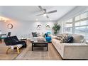Bright and airy living room with a ceiling fan, lots of natural light, and stylish decor at 2311 Ashland Blvd, Orlando, FL 32808
