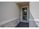 Close up of the front door with sidelights and a decorative wreath at 2720 Bancroft Blvd, Orlando, FL 32833