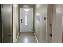 Inviting foyer with a decorative front door, neutral walls, and tiled flooring at 3243 Little Sound Dr, Orlando, FL 32827