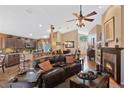 Spacious living room featuring hardwood floors, a fireplace, comfortable seating, and an open layout at 3655 Seminole Dr, Orlando, FL 32812