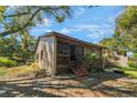 Charming exterior view featuring a screened-in porch and natural surroundings at 3901 Villas Green Cir # 1, Longwood, FL 32779