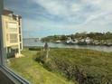 Beautiful water view from the condo overlooking the harbor, bridge and lush landscaping at 434 Bouchelle Dr # 202, New Smyrna Beach, FL 32169