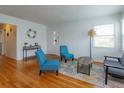 Spacious living room featuring hardwood floors, comfortable seating, and a stylish area rug, ideal for relaxation at 476 Zelda Blvd, Daytona Beach, FL 32118