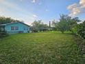 Expansive backyard featuring a well-maintained lawn and mature trees, perfect for outdoor activities and relaxation at 805 Glen Arden Way, Altamonte Springs, FL 32701