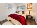 Cozy bedroom with a plush bed, soft lighting, and a decorative floral painting at 908 Cannes Pl, Orlando, FL 32808