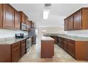 Spacious kitchen equipped with stainless steel appliances and granite countertops at 16217 Saint Augustine St, Clermont, FL 34714