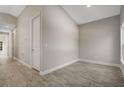 Hallway with a door on the left and a window on the right at 179 Douglas Ave, Chuluota, FL 32766