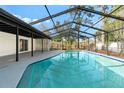 Inviting screened-in pool area perfect for relaxation and entertaining in the backyard at 2555 Sweetwater Trl, Maitland, FL 32751