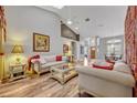 Spacious living room with vaulted ceiling, hardwood floors, and comfortable furnishings creating an inviting space at 2954 Willow Bay Ter, Casselberry, FL 32707