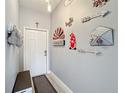 Foyer with decor and neutral gray paint at 4103 Calabria Ave, Davenport, FL 33897
