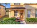 Inviting front porch with seating area and decorative touches at 4103 Calabria Ave, Davenport, FL 33897