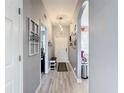 Hallway with light wood flooring and decor at 4103 Calabria Ave, Davenport, FL 33897