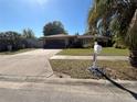 Well-maintained home featuring a spacious driveway, attached garage, and welcoming curb appeal at 5132 Goldenrod Place Rd, Winter Park, FL 32792