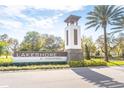 Lakeshore at Narcoossee community sign with palm trees on a sunny day at 5156 Caspian St, St Cloud, FL 34771