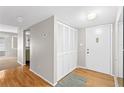 Entryway view featuring a coat closet, hardwood floors, and gray walls at 543 Fairways Dr # B, Ocala, FL 34472