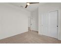 Bright bedroom with neutral carpet, ceiling fan, and closet at 1773 Groveline Rd, St Cloud, FL 34771