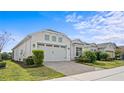 A beautiful house featuring a manicured lawn and inviting curb appeal at 2087 Flora Pass Pl, Kissimmee, FL 34747