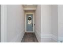 Inviting entryway with a charming blue front door and brick pathway at 2087 Flora Pass Pl, Kissimmee, FL 34747