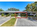 Charming single-story home with a well-manicured lawn, blue shutters, and a neatly trimmed front hedge at 2723 Beacon St, Eustis, FL 32726