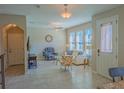 Inviting living room featuring tile floors, neutral paint, and lots of natural light at 3593 Brighton Park Cir, Belle Isle, FL 32812
