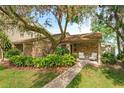 Inviting single-story home with brick facade, manicured landscaping, and a cozy front porch at 409 Oak Haven Dr # 409, Altamonte Springs, FL 32701
